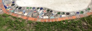 Glass, metal, keys, bike parts, bricks, tiles, stones, all reused to create a mosaic in North Mountain Park